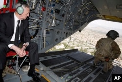 FILE - U.S. Defense Secretary James Mattis looks out over Kabul as he arrives via helicopter at Resolute Support headquarters in Kabul, Afghanistan, April 24, 2017.