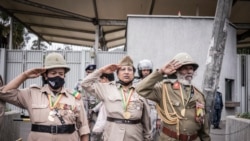 War veterans salute as people gather during a protest against purported fake news and foreign meddling at the British Embassy of Ethiopia in Addis Ababa, Ethiopia, Nov. 25, 2021.