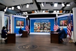From left, CDC Director Dr. Rochelle Walensky, President Joe Biden, White House COVID coordinator Jeff Zients and Dr. Anthony Fauci meet remotely with governors at the White House.