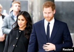 FILE - Britain's Prince Harry and Meghan, Duchess of Sussex in London, Britain March 19, 2019.