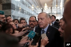 Turkey's President Recep Tayyip Erdogan speaks to the media in Ankara, Turkey, Jan. 8, 2019.