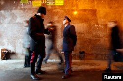 FILE - Russian cossacks patrol near a train station in central Moscow, November 27, 2012.