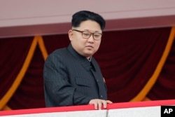FILE - North Korea's leader Kim Jong Un watches a parade in Pyongyang.