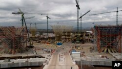 FILE - Construction work is seen on a new airport in Texcoco, Mexico, Oct. 17, 2018.