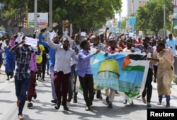 Somalis attend a protest against U.S. President Donald Trump's decision to recognize Jerusalem as the capital of Israel, in Mogadishu, Somalia, Dec. 8, 2017.