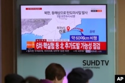 Visitors sit in front of the TV screen showing a news program reporting about North Korea's missile firing, at Seoul Train Station in South Korea, April 5, 2017. North Korea fired a ballistic missile into its eastern waters Wednesday.