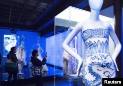 Members of the media view selections for the Metropolitan Museum of Art Costume Institute Gala Benefit, "China: Through the Looking Glass," during a media preview at the Metropolitan Museum of Art in New York, May 4 , 2015.
