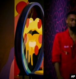 A three-dimensional sculpture from artist Shawna X called "Say Cheese," is part of a group art exhibition celebrating pizza at The Museum of Pizza in New York, Nov. 2, 2018. While pizza may be the hook that draws those interested to the museum, the focus of MoPi is to expose visitors to the fine art world.