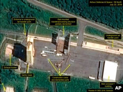 This July 22, 2018, satellite image released and annotated by 38 North on Monday, July 23, shows what the U.S. research group says is the partial dismantling of the rail-mounted transfer structure, at center, at the Sohae launch site in North Korea.