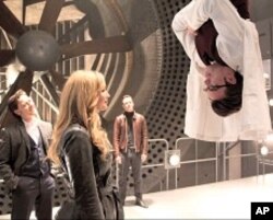 Dr. Hank McCoy (Nicholas Hoult) demonstrates his mutant powers to an appreciative Raven (Jennifer Lawrence), Charles (James McAvoy) and Erik (Michael Fassbender)