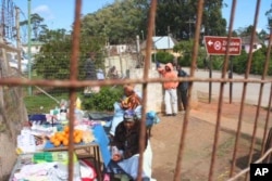 Women sell fruit outside the gates of Zithulele Hospital … In the same spot as Motlhabane’s mother once did