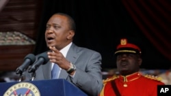 FILE - Kenya President Uhuru Kenyatta delivers a speech during Mashujaa Day -- also known as Heroes Day -- at the Nyayo Nationa Stadium, in Nairobi, Kenya, Oct. 20, 2014. 