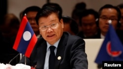 Laos' Prime Minister Thongloun Sisoulith speaks at the 10th Cambodia-Laos-Vietnam summit as part of the Greater Mekong Subregion Summit in Hanoi, Vietnam, March 31, 2018. 