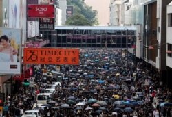 Anti-government demonstrators attend a protest march in Hong Kong, China, Oct. 20, 2019.