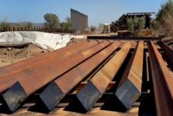Sections of Pentagon-funded border wall are stacked before installation, Sept. 10, 2019, in Yuma, Ariz. A 30-foot-high wall will replace a five-mile section of Normandy barrier and post-n-beam fencing along the Mexico-United States border.