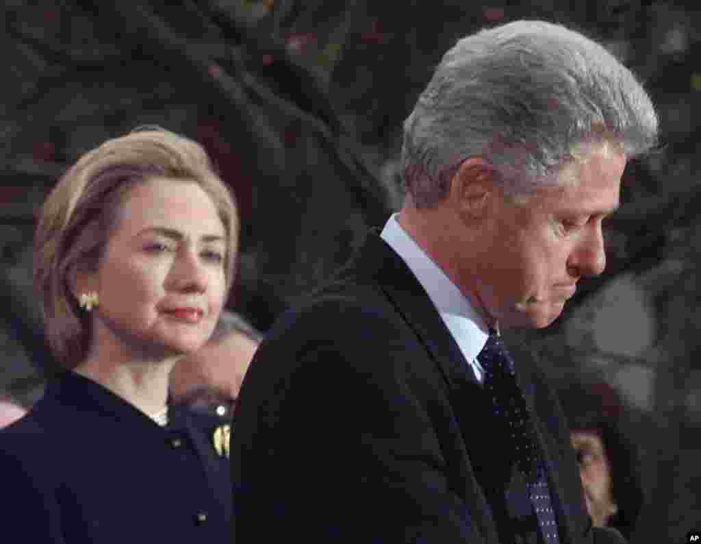 President Clinton makes a statement as first lady Hillary Rodham Clinton looks on at the White House, Saturday, Dec. 19, 1998 thanking those Democratic members of the House of Representatives who voted against impeachment and vowing to complete his term. 