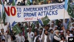 Supporters of a Pakistani religious party Jamaat-e- Islami arrive to join a rally against the U.S. drone strikes in Pakistani tribal areas, in Peshawar, April 23, 2011