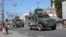 Armored vehicles of the Kenyan peace-keeping mission patrol as residents flee their neighborhood due to gang violence, in Port-au-Prince, Haiti, Feb. 25, 2025. 