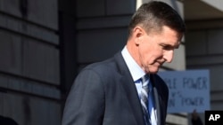 FILE - Former Trump national security adviser Michael Flynn leaves federal court in Washington, Dec. 1, 2017.