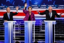 From left, Democratic presidential candidates, former New York City Mayor Mike Bloomberg, Sen. Elizabeth Warren, D-Mass., Sen. Bernie Sanders, I-Vt., participate in a Democratic presidential primary debate, Feb. 19, 2020, in Las Vegas.