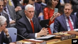 U.S. Vice President Mike Pence, center, addresses a meeting on Venezuela in the United Nations Security Council at U.N. headquarters, April 10, 2019.