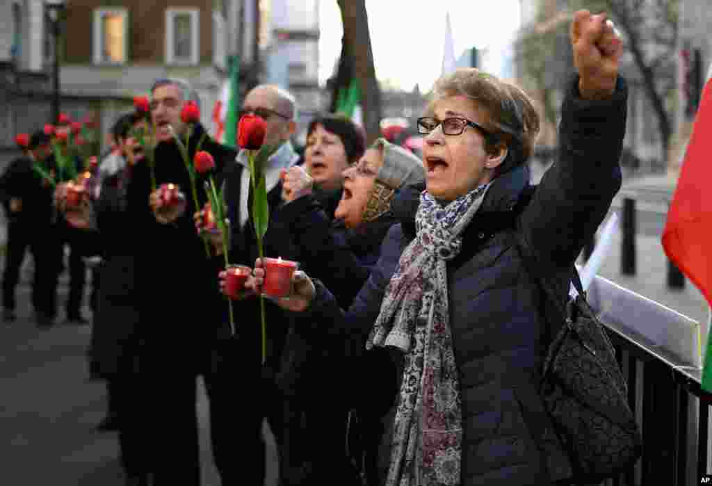 People take part in a vigil held by the Anglo-Iranian Communities in the UK and supporters of the National Council of Resistance of Iran in Whitehall, London, Jan. 10, 2020, for the passengers of the Ukrainian 737-800 plane crash in Iran.