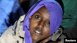 A migrant looks on during a rescue operation by the Libyan coast guard in the Mediterranean Sea, Libya, March 15, 2018.