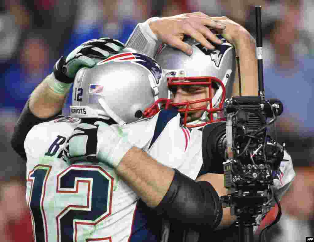 Quarterback Tom Brady (L) of the New England Patriots and teammates celebrate victory over the Seattle Seahawks in Super Bowl XLIX at University of Phoenix Stadium in Glendale, AZ.