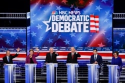 From left, Democratic presidential candidates, former New York City Mayor Mike Bloomberg, Sen. Elizabeth Warren, D-Mass., Sen. Bernie Sanders, I-Vt., former Vice President Joe Biden, former South Bend Mayor Pete Buttigieg, Sen. Amy Klobuchar, D-Minn., participate in a Democratic presidential primary debate, Feb. 19, 2020, in Las Vegas, hosted by NBC News and MSNBC.