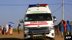 An ambulance drives in a border reception center housing Ethiopian refugees who fled the fighting in Tigray Region, in Sudan's eastern Gedaref State on November 29, 2020.