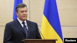 FILE - Ousted Ukrainian president Viktor Yanukovych makes a statement during a news conference in the southern Russian city of Rostov-on-Don, March 11, 2014. 