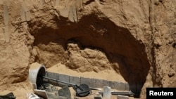 FILE - Part of a tunnel exposed by the Israeli military is seen on the Israeli side of the Israel-Gaza border, Aug. 14, 2014