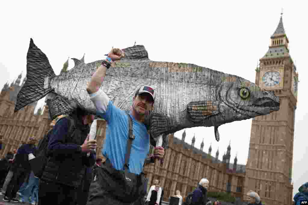 Protesters attend a "March for Clean Water" in London, calling for the government to "stop the poisoning of Britain's waters."