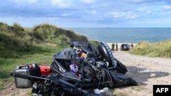 This photograph taken on Sept. 15, 2024 shows the damaged migrants' boat after a failed attempt to cross the English Channel that led to the death of eight people near the beach of Ambleteuse, northern France.