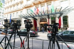 FILE - TV cameras are set up in front of the Grand Hotel Vienna, where closed-door nuclear talks take place in Vienna, Austria, June 20, 2021.
