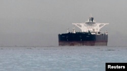 FILE - Malta-flagged Iranian crude oil supertanker "Delvar" is seen anchored off Singapore, March 1, 2012.