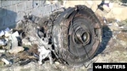 FILE - An engine from Ukraine International Airlines Flight PS752, which was shot down after taking off from Tehran's Imam Khomeini airport on Jan. 8, 2020, is seen in this image from Iran Press footage. (Iran Press via Reuters)