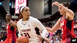 FILE - Stanford guard DiJonai Carrington (21) dribbles as Team USA guard Diana Taurasi, right, defends in the fourth quarter of an exhibition women's basketball game, Nov. 2, 2019, in Stanford, Calif. 