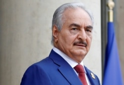 FILE - Khalifa Haftar, the military commander who dominates eastern Libya, arrives to attend an international conference on Libya at the Elysee Palace in Paris, May 29, 2018.