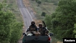 Українські військовослужбовці поблизу Вовчанська, Харківщина, 12 червня 2024. REUTERS/Viacheslav Ratynskyi