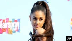 FILE - Ariana Grande arrives at the "Hairspray Live!" Press Junket at the Universal Lot on Nov. 16, 2016, in Universal City, Calif.