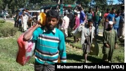 Rohingya men have just arrived from Myanmar, at an unidentified place in Cox's Bazar district, Bangladesh. 