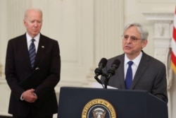 U.S. Attorney General Merrick Garland, accompanied by U.S. President Joe Biden, delivers remarks on steps to curtail U.S. gun violence, in Washington, June 23, 2021.