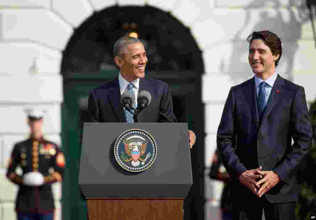 Canadian Prime Minister Justin Trudeau listens as President Barack Obama speaks during an arrival ceremony on the South Lawn of the White House in Washington, March 10, 2016.