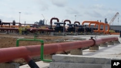 FILE - Oil pipelines are seen during the opening ceremony of Africa’s biggest oil refinery in Lagos, Nigeria, May 22, 2023. (AP/Sunday Alamba)