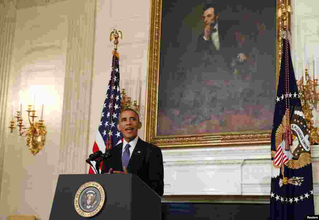 U.S. President Barack Obama talks about the humanitarian relief situation in Iraq inside the State Dining Room of the White House, in Washington, DC, Aug. 7, 2014.