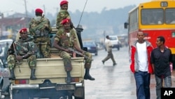 Ethiopia Protests: FILE - In this June 10, 2005 file photo, members of the Ethiopian army patrol the streets of Addis Ababa, Ethiopia, after recent clashes with protesters. Violent weekend clashes between protesters and security forces have claimed the lives of more than a dozen people across Ethiopia. The government announced Sunday, Aug. 7, 2016 that seven protesters died in the northern Amhara region's capital, Bahir Dar. 
