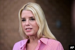 FILE - Pam Bondi, former Florida attorney general, speaks to reporters June 18, 2024, in Newtown, Pa. President-elect Donald Trump said on Nov. 21, 2024, that he would nominate Bondi to serve as U.S. attorney general.