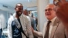 FILE - Sylvain Itte, right, French Ambassador to Niger, greets French journalist Olivier Dubois, at the airport in Niamey, Niger, March 20, 2023. 