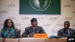Bankole Adeoye, center, AU Commissioner for Political Affairs, Peace and Security, explains the African Union's position on conflicts on the continent during a press conference at the 38th African Union Summit in Addis Ababa, Ethiopia, Feb. 16, 2025.